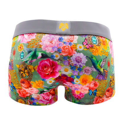 Schockhöschen Panty Kolibri Rückansicht — Kolibris, Rosen und Schmetterlinge auf olivgrünem Grund, grauer Bund, goldenes Logo, maximalistischer Blumenprint